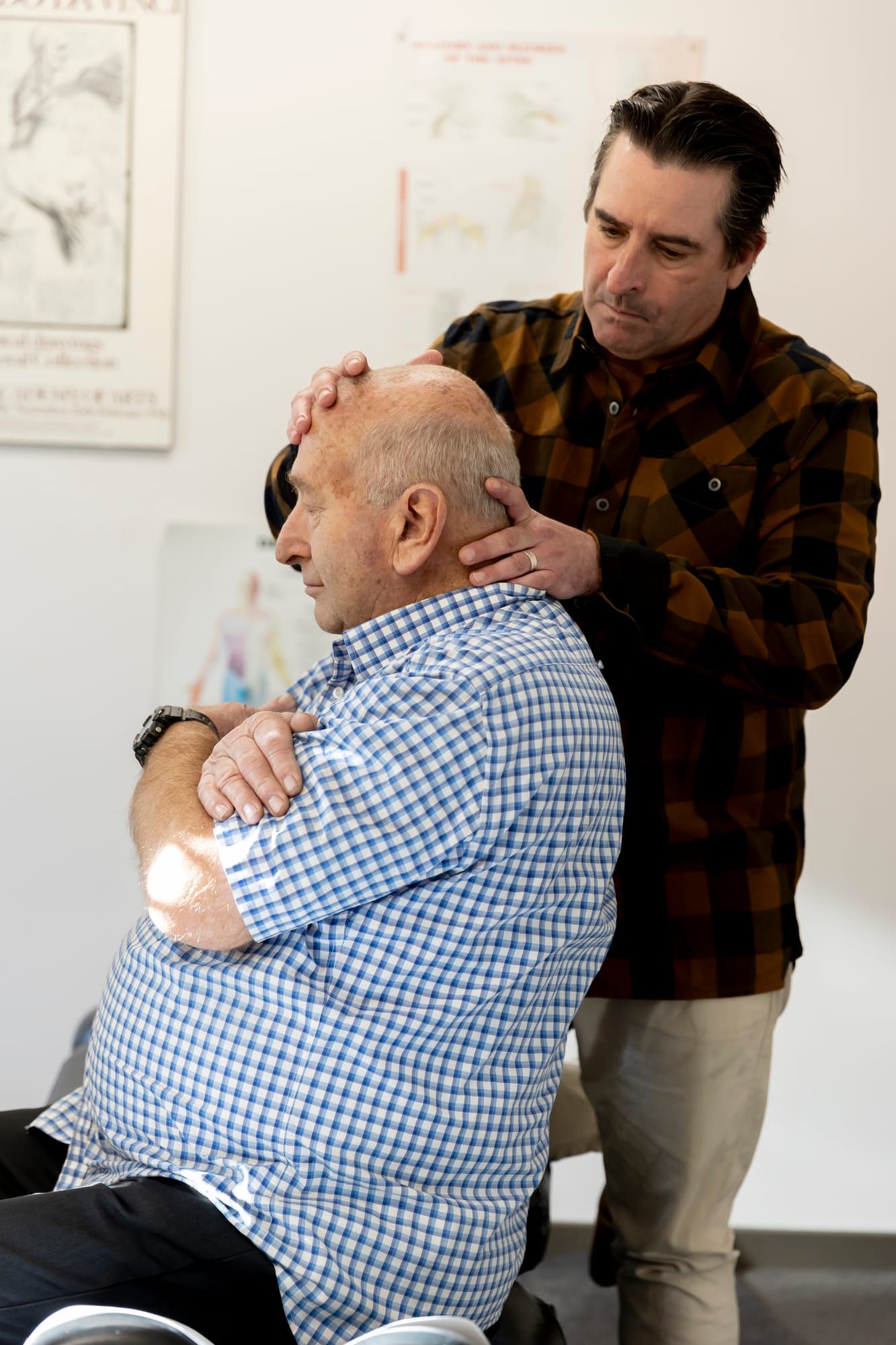 Simon working with a seated patient